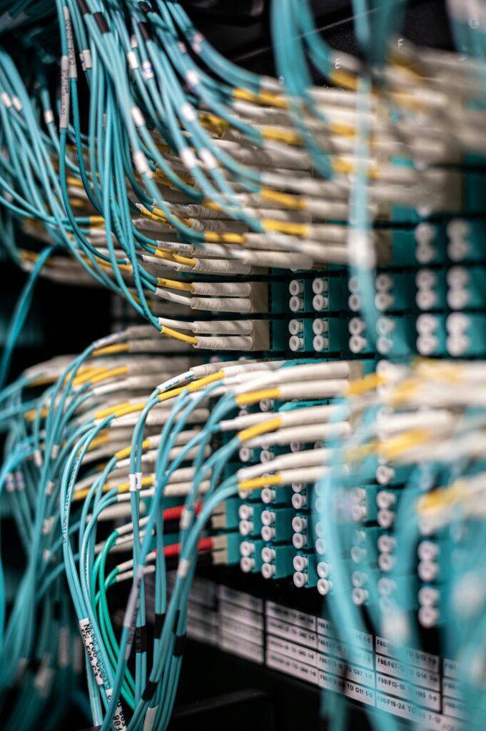 pexels photo 5087172 5087172 Rows of blue cables and wires plugged into server patch panel located in modern data center framework